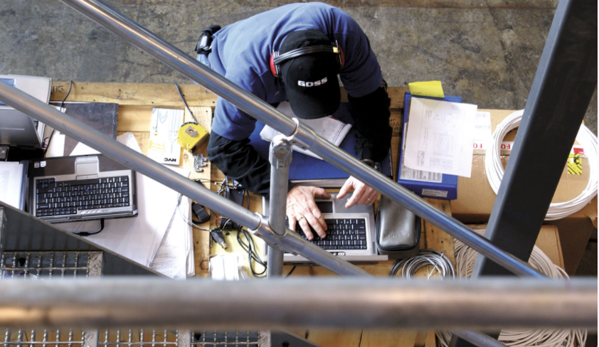 overhead view of man working on computer